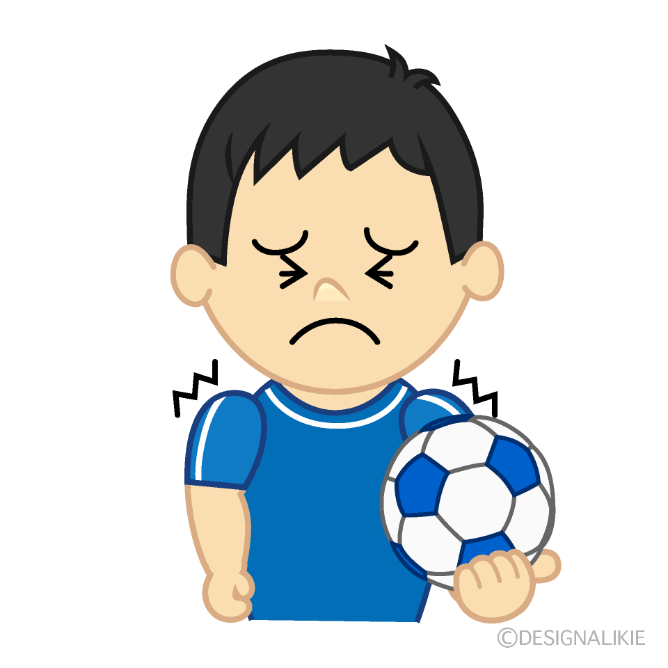 我慢するサッカー少年