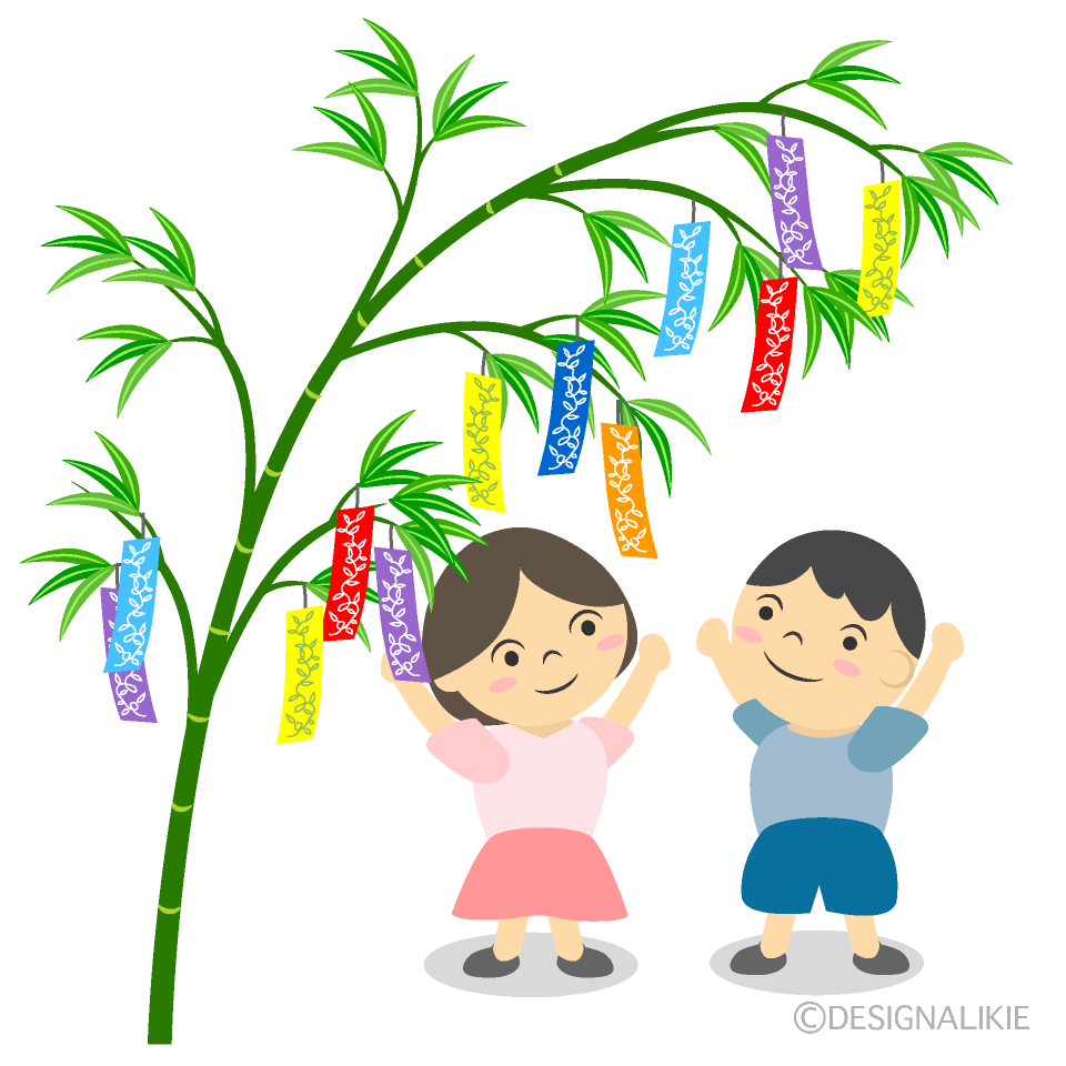 七夕の短冊を飾る子供