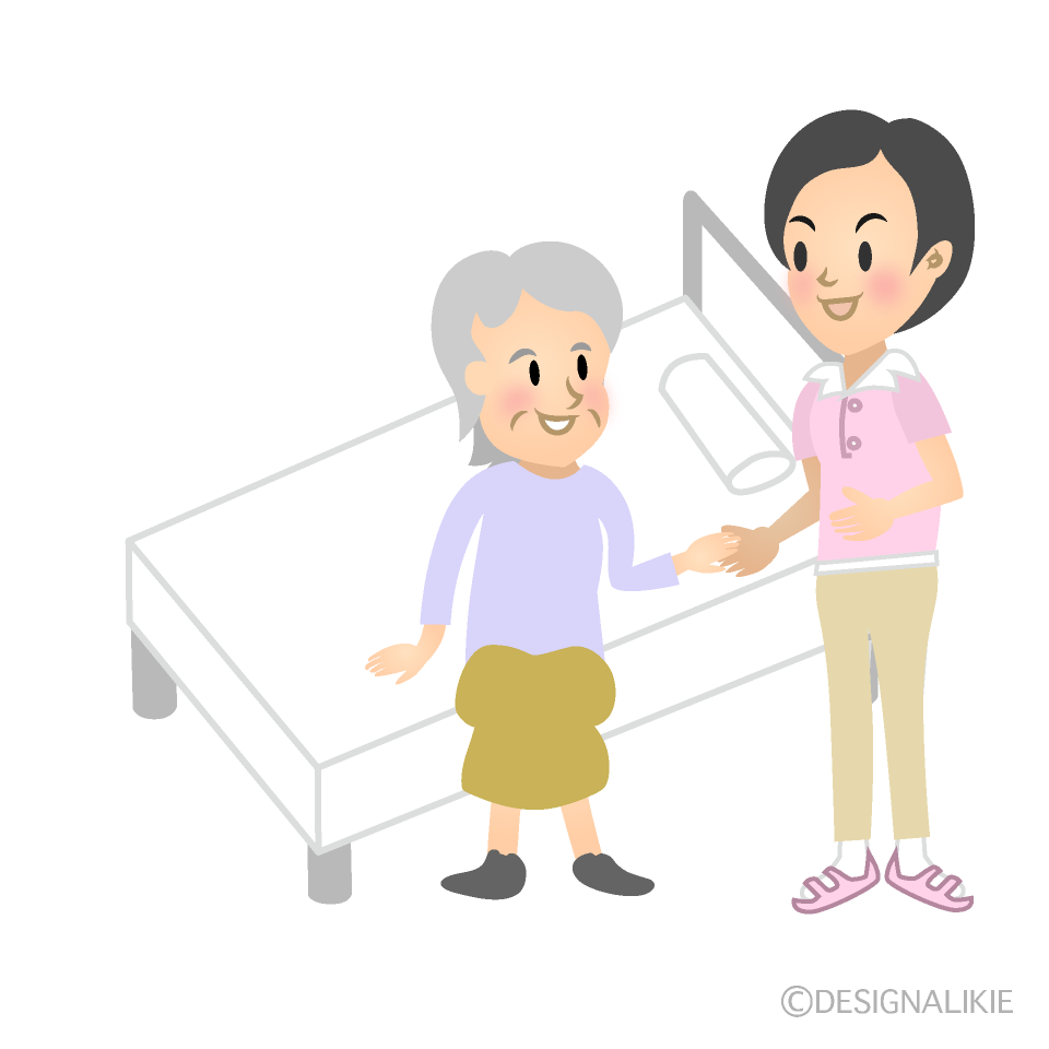 ベットでサポートする女性ヘルパー